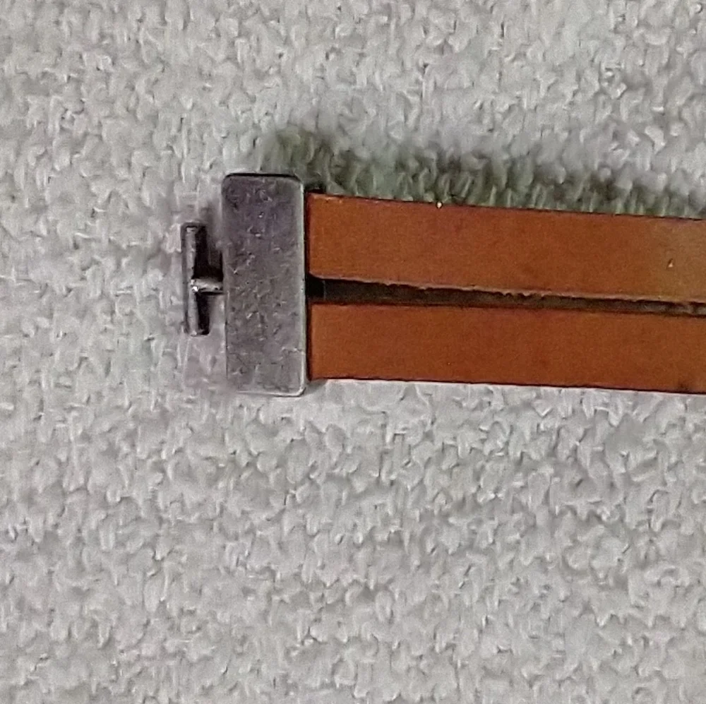 Silvertone faux amber brown leather bracelet